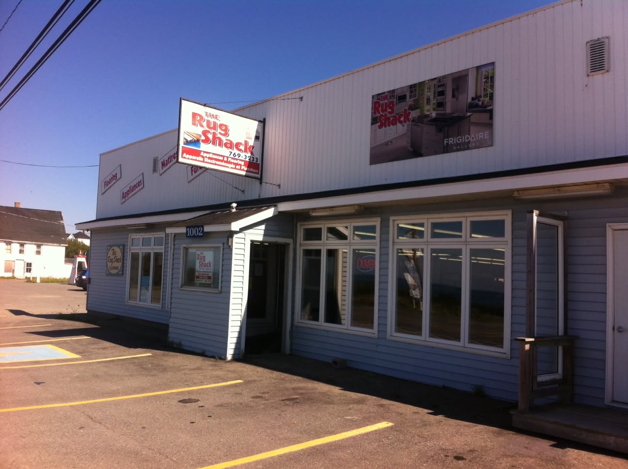 The Rug Shack storefront at 1002 Highway 1, Church Point, Nova Scotia — flooring, appliances, mattresses & furniture
